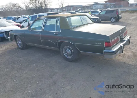 1985 Buick Lesabre Limited z USA, uszkodzony, nr VIN 1G4BP69Y3FX423652